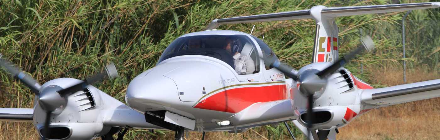 front view of a one airs diamond da42 with a pilot