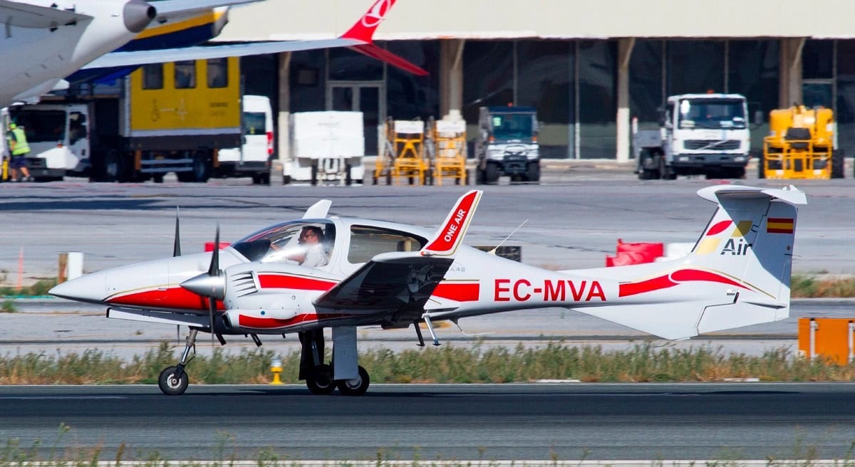 side view of a one airs diamond da42 at malagas international airport