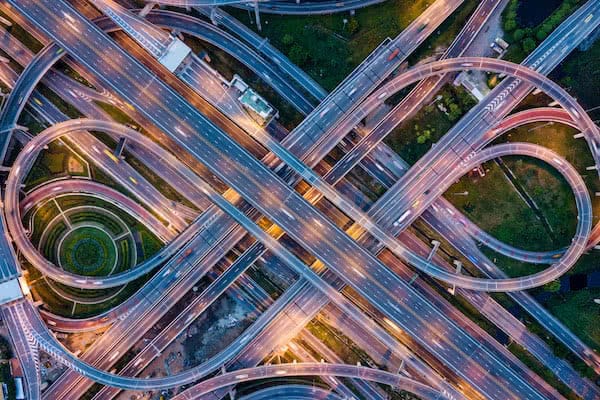 aerial view of road junction guarded with industrial drones