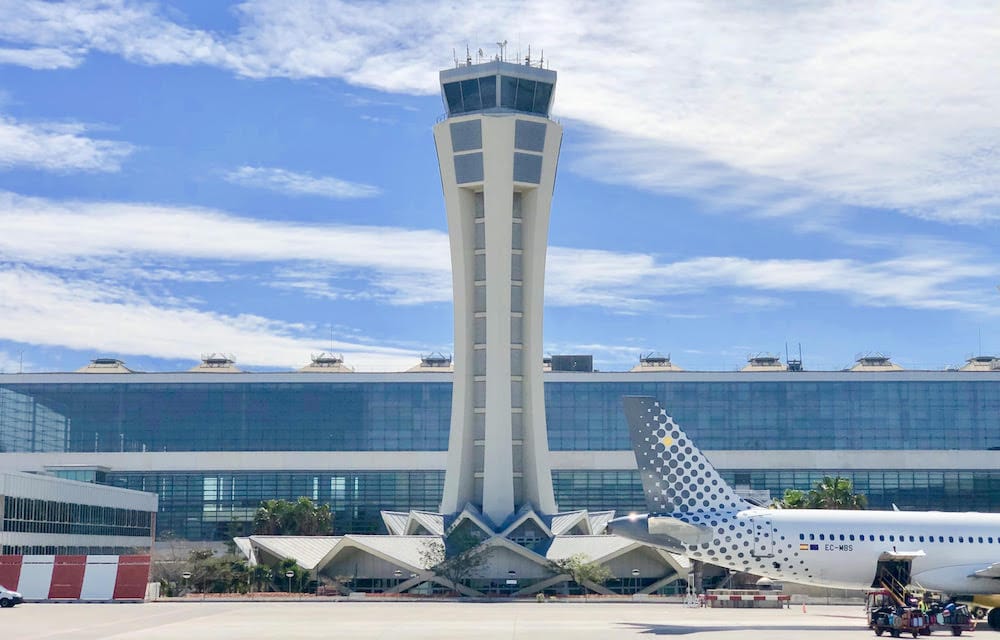 Malaga Airport control tower with the Pablo Ruiz Picasso terminal behind it.