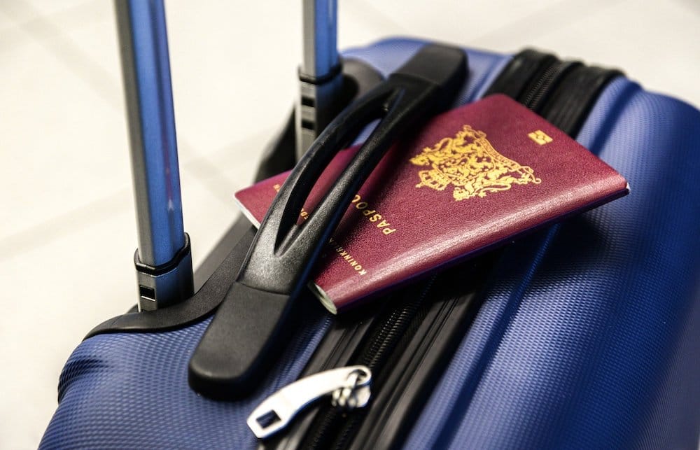 your-journey-begins-when-you-are-packing Passport over a hand luggage.