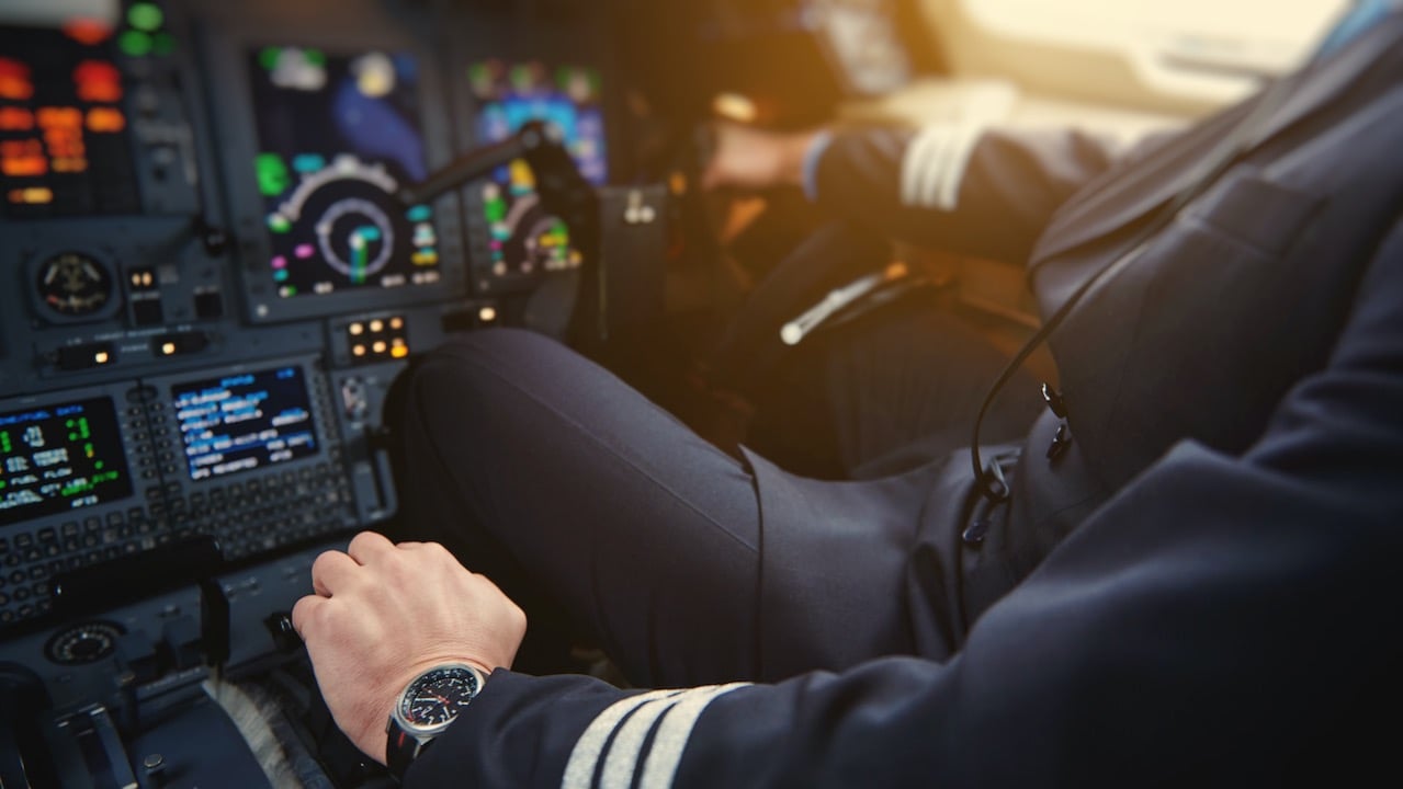 A pilot managing an aircraft