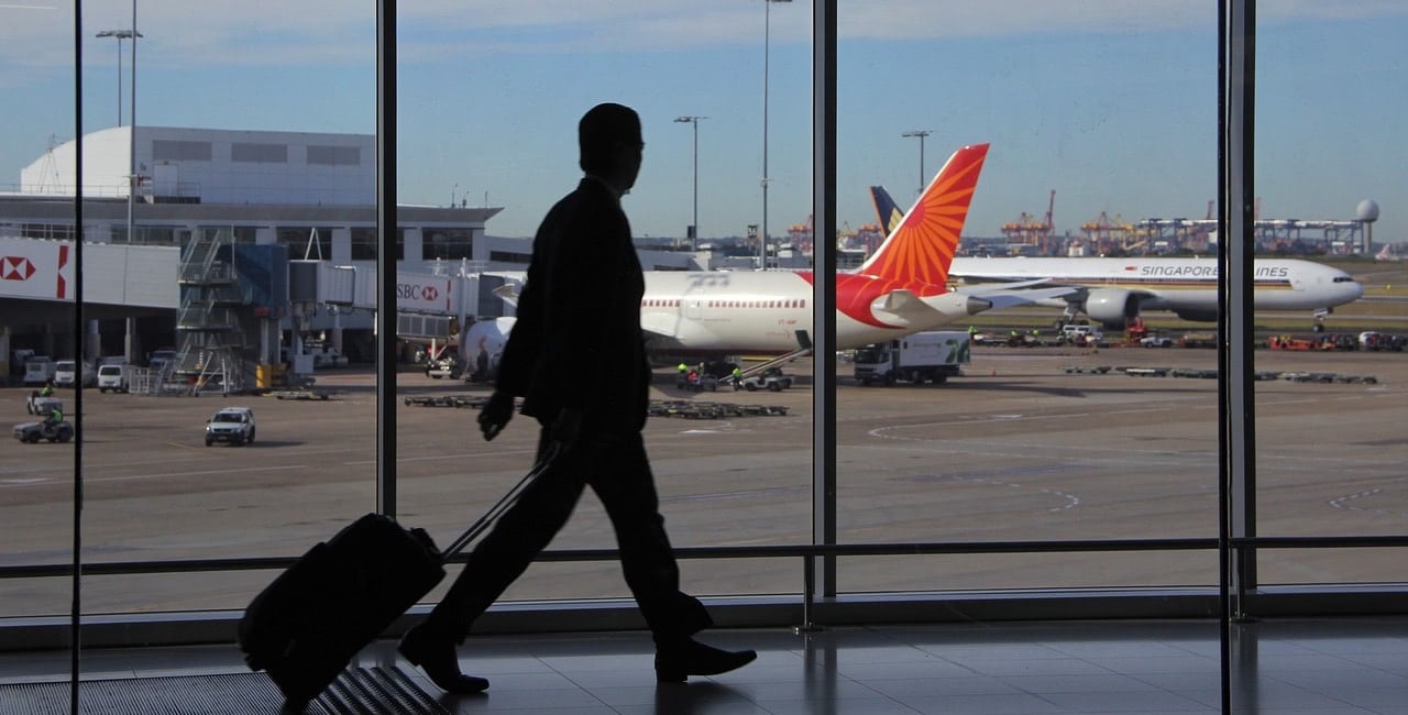 Passenger walking at the airport to take a flight