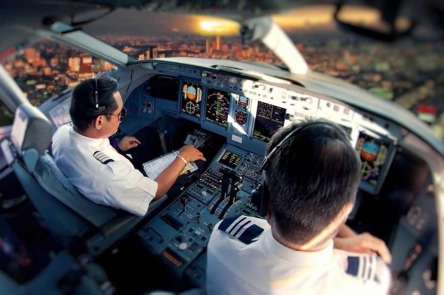 A flight instructor teaching a student