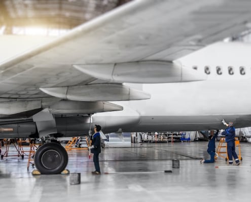 Mechanics preparing an aircraft for flight