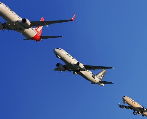 Three boeing planes flying close to each other