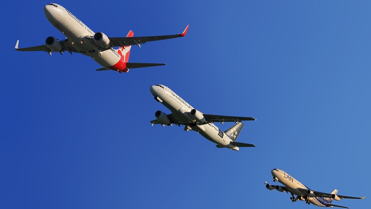 Three boeing planes flying close to each other