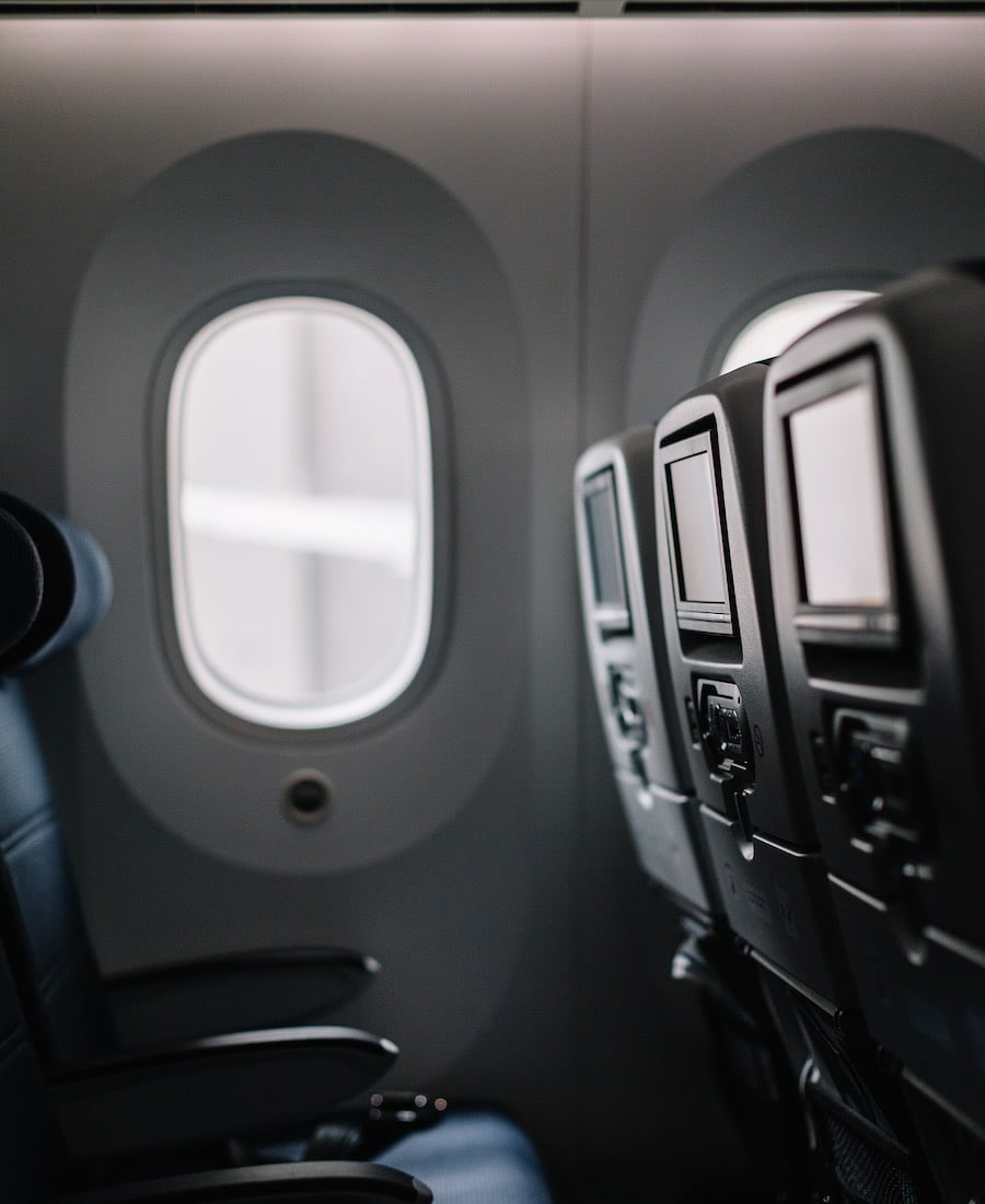 Airplane seats aligned with the windows